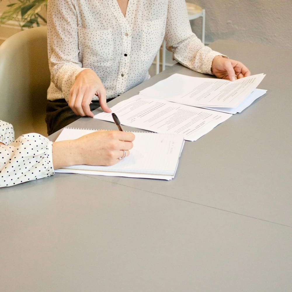Going through mortgage paperwork at a bright table